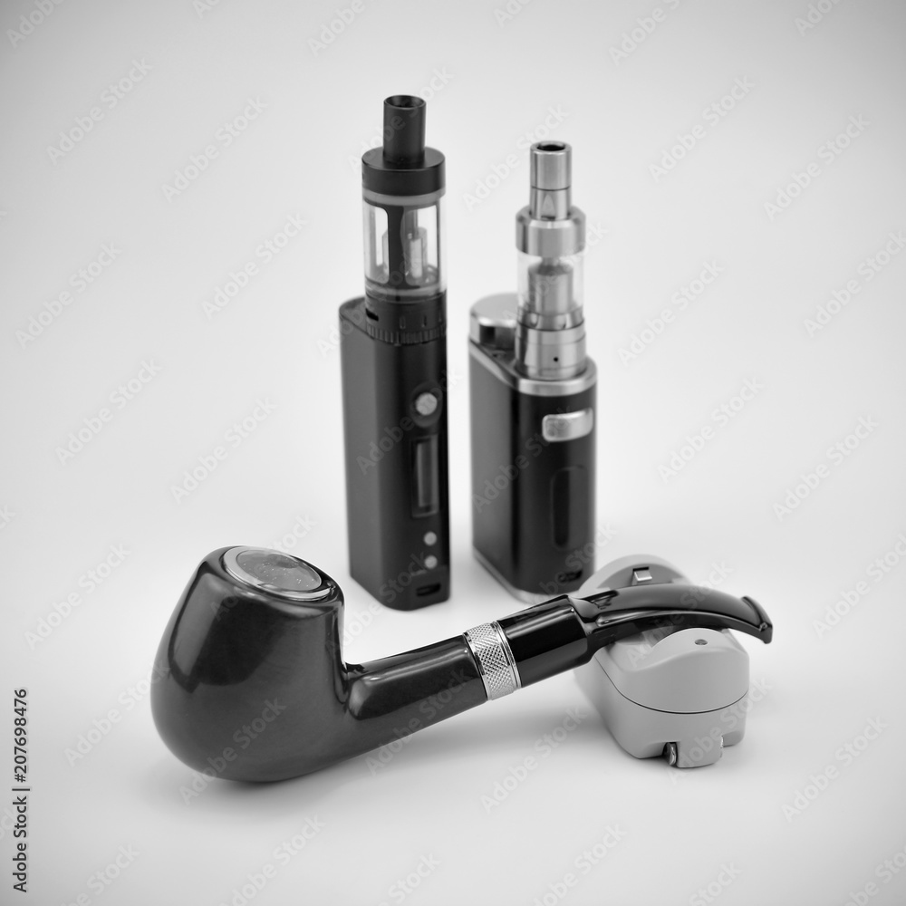 E - cigarette for vaping , technical devices.The liquid in the bottle E - cigarette for vaping , technical devices.The liquid in the bottle
