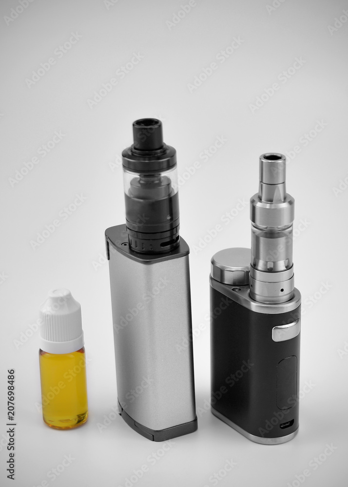 E - cigarette for vaping , technical devices.The liquid in the bottle E - cigarette for vaping , technical devices.The liquid in the bottle