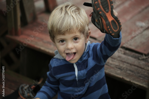 Photo of adorable young happy boy looking at camera.