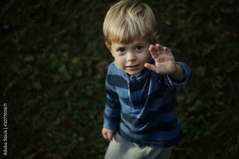 Photo of adorable young happy boy looking at camera. Photo of adorable young happy boy looking at camera.