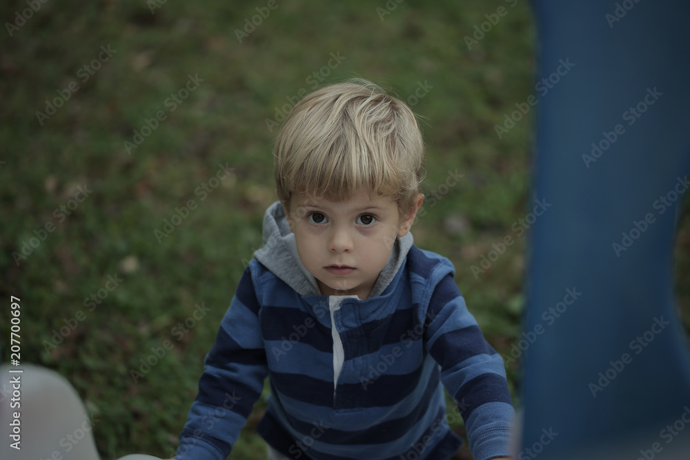Photo of adorable young happy boy looking at camera. Photo of adorable young happy boy looking at camera.