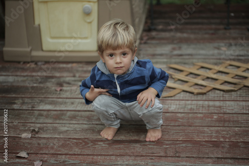 Photo of adorable young happy boy looking at camera.