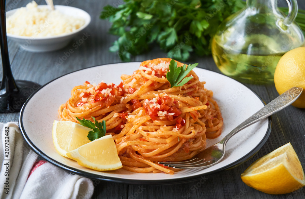 Spaghetti with tomato sauce, vegetables and cheese