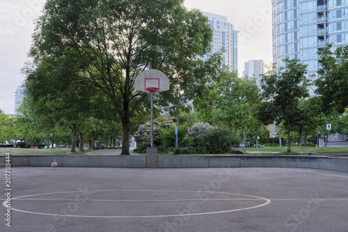 Basketball court in urban area. Dusk, dramatic view. Vancouver BC, Canada