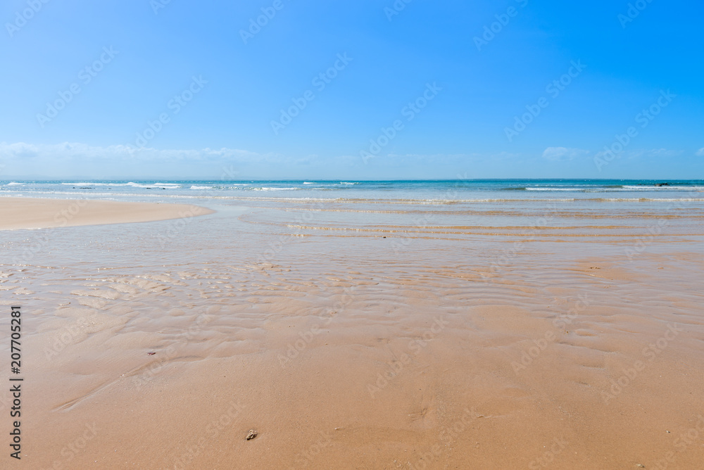 Texture beach sandy surface with ripples formed