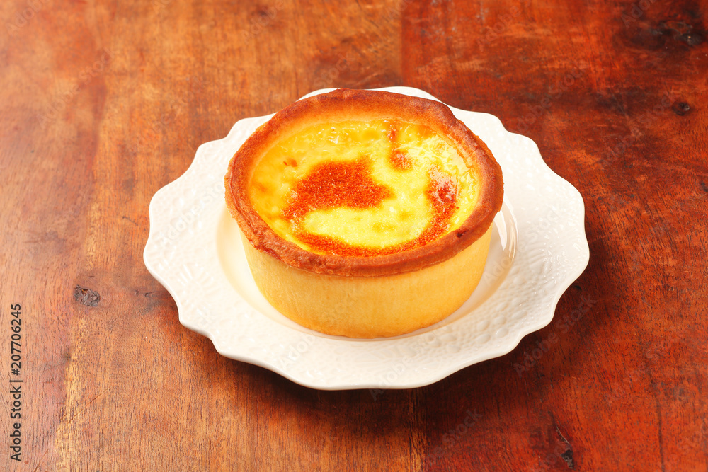 Baked egg tart on old wood background. Baked egg tart on old wood background.