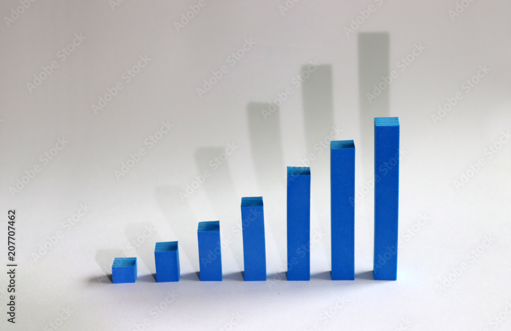 A blue bar graph with shadows on a white background. A blue bar graph with shadows on a white background.