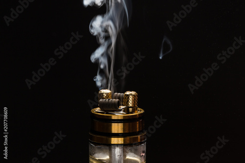 Vape close-up with smoke on a black background