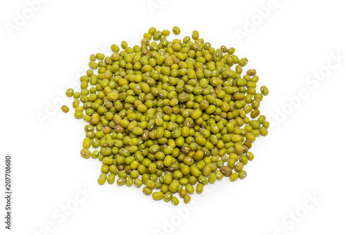 Pile of green lentils on a white background