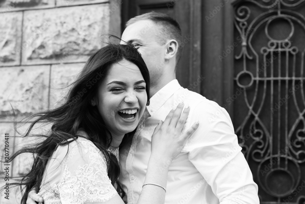 A young, sympathetic couple walks through the streets of the city. A young, sympathetic couple walks through the streets of the city.