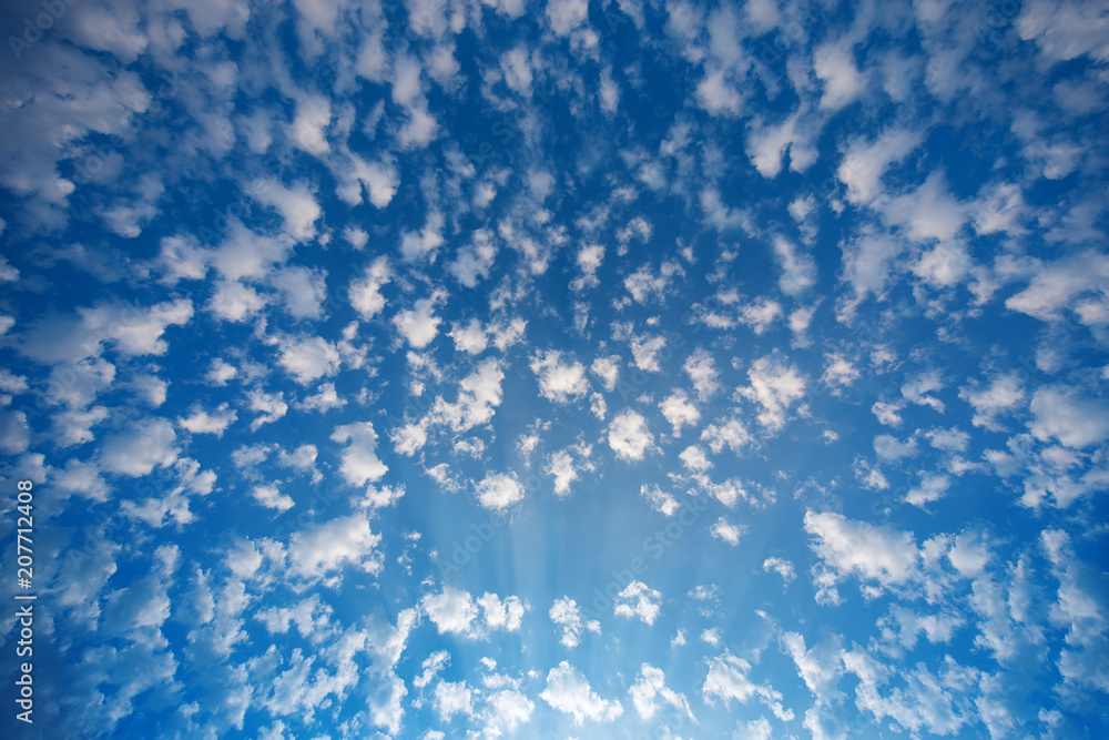 Blue sky and fluffy white clouds, sunrise shot Blue sky and fluffy white clouds, sunrise shot