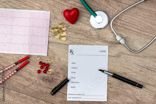 medical concept - Pharmacy receipt, stethoscope, heart, syringe and cardiogram