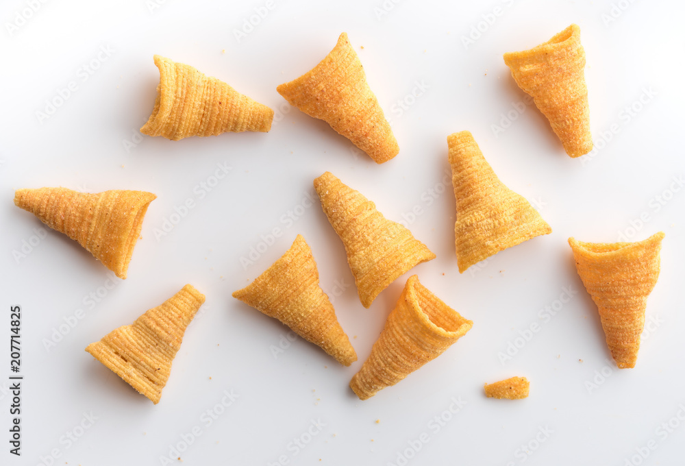 Crunchy corn snacks on a white background,top view Crunchy corn snacks on a white background,top view