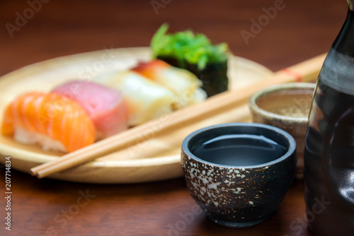 sake cup with sushi background