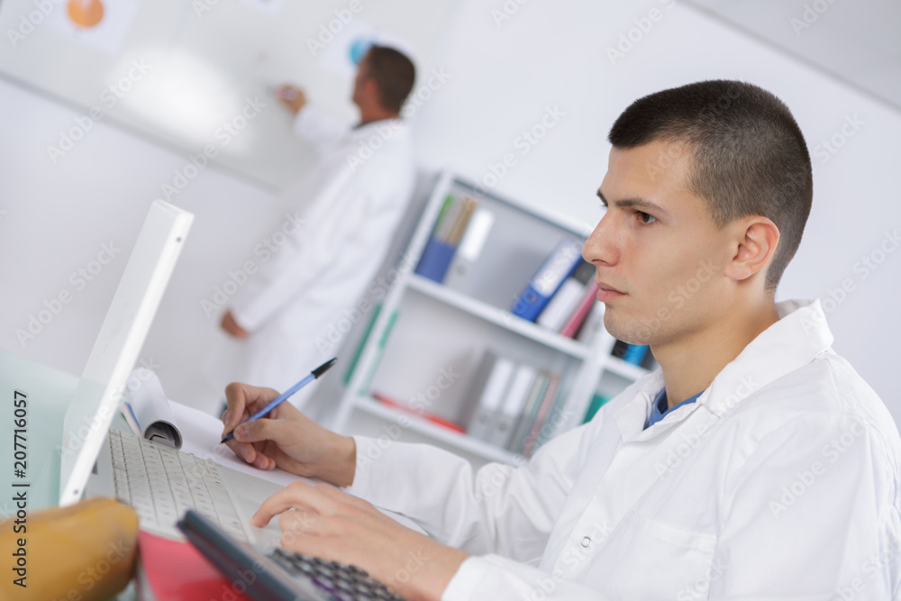 young scientist reads an interesting research publication young scientist reads an interesting research publication
