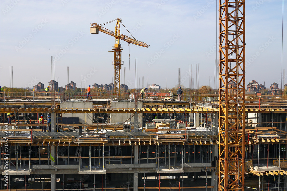 building construction site with workers and cranes industry building construction site with workers and cranes industry