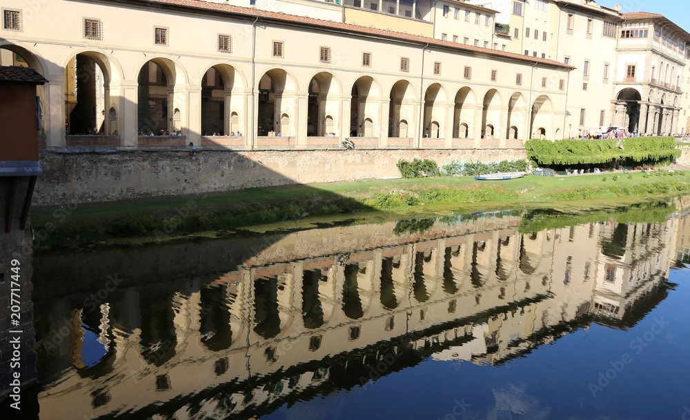 Reflection on the Arno river of the passage called Vasari  corri