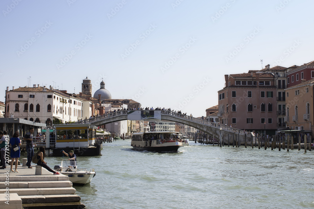 Beautiful view of Grand Canal in Venice, Italy. Water bus and taxi. Tourists enjoy views