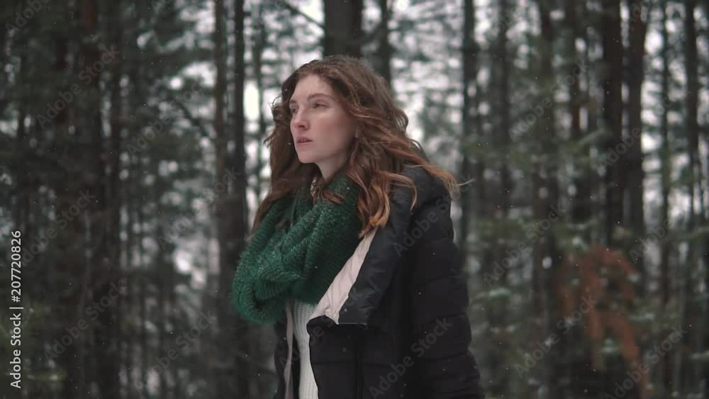 portrait of a strange and mysterious red-haired girl in a winter forest portrait of a strange and mysterious red-haired girl in a winter forest