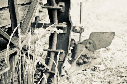 old tractor with plow, historical photo