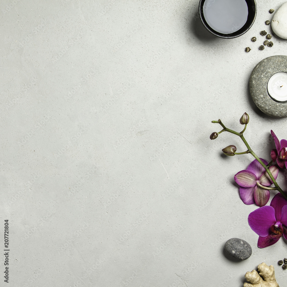 Asian tea set and spa stones on concrete background Asian tea set and spa stones on concrete background