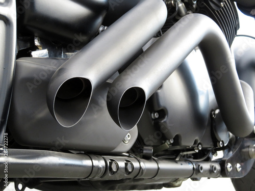 Motorcycle engine exhaust pipes close-up. Motor bike exhaust pipes photo