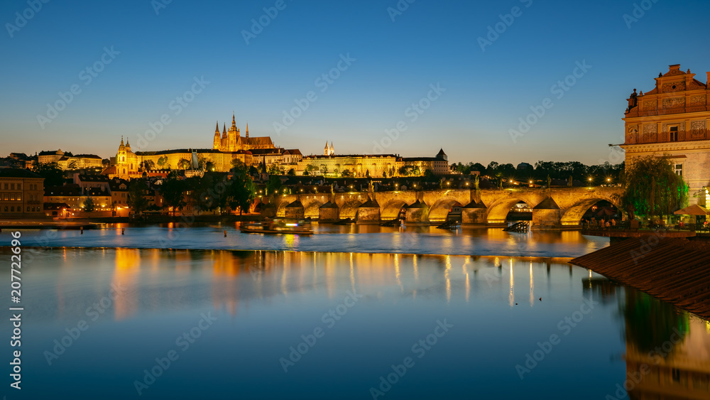 Panorama view of Saint Vitus Cathedral with Prague city skyline at night in Prague, Czech Republic