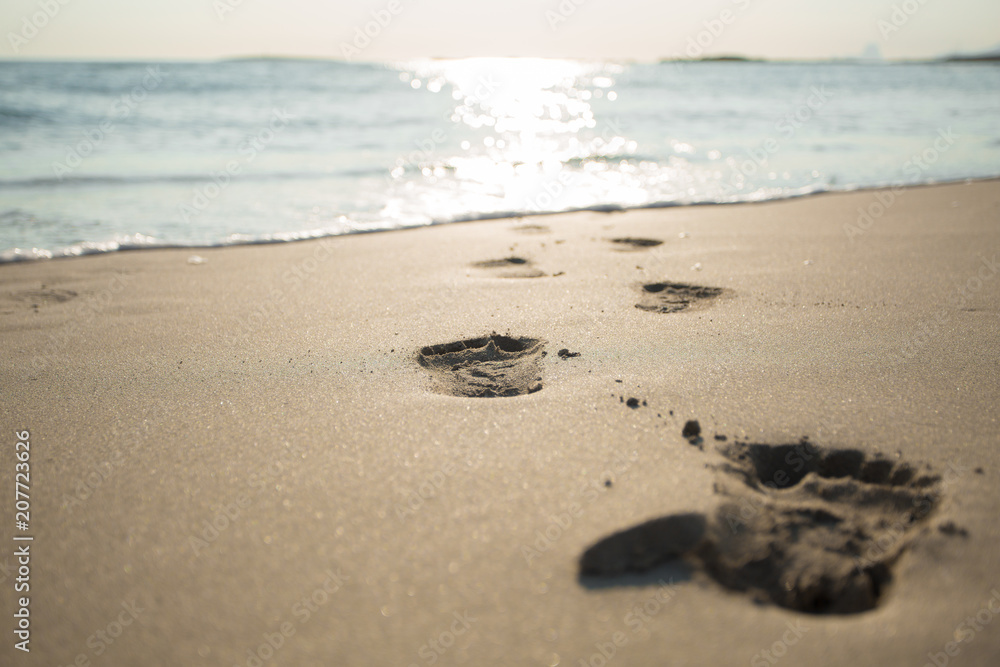 Beach. Sea. Ocean. Footprints, footsteps in the water. Sunny path on the water. Beach. Sea. Ocean. Footprints, footsteps in the water. Sunny path on the water.