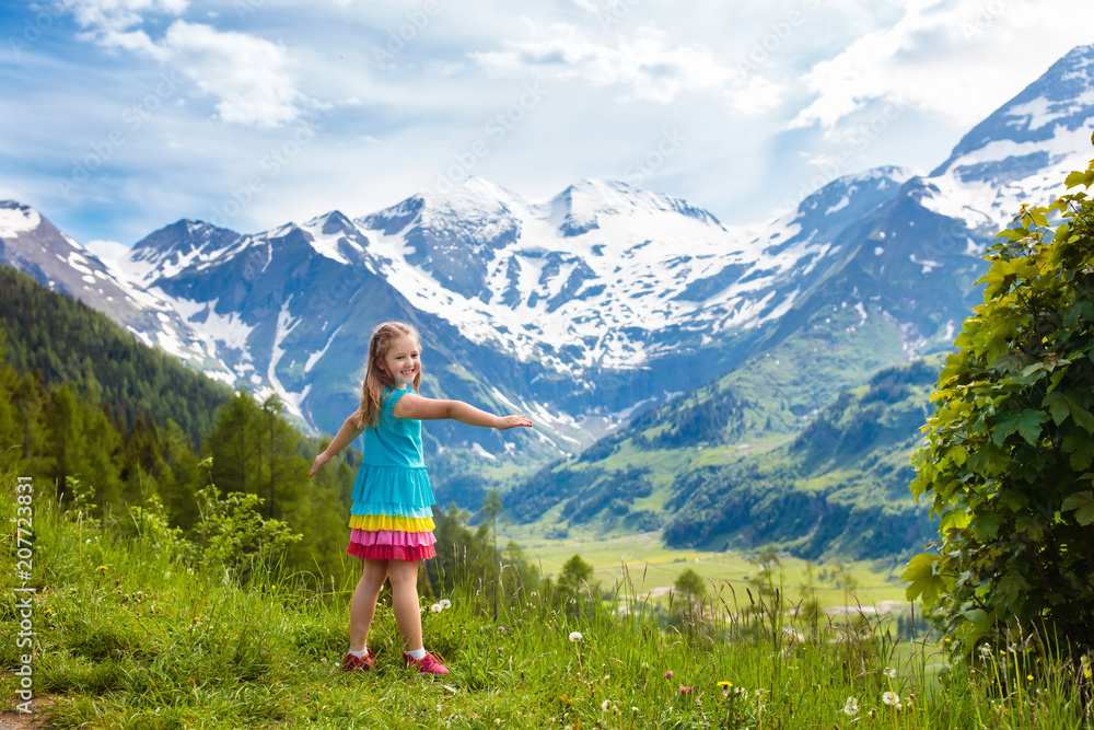 Naklejka premium Children hiking in Alps mountains. Kids outdoor.