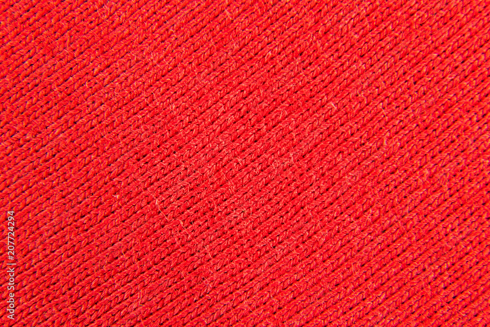 background of a fabric of red color weaving close-up background of a fabric of red color weaving close-up