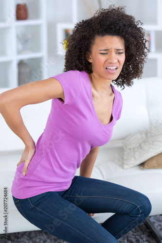 Photos woman with severe lower back pain