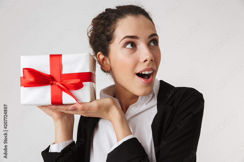 Excited young business woman holding surprise Excited young business woman holding surprise