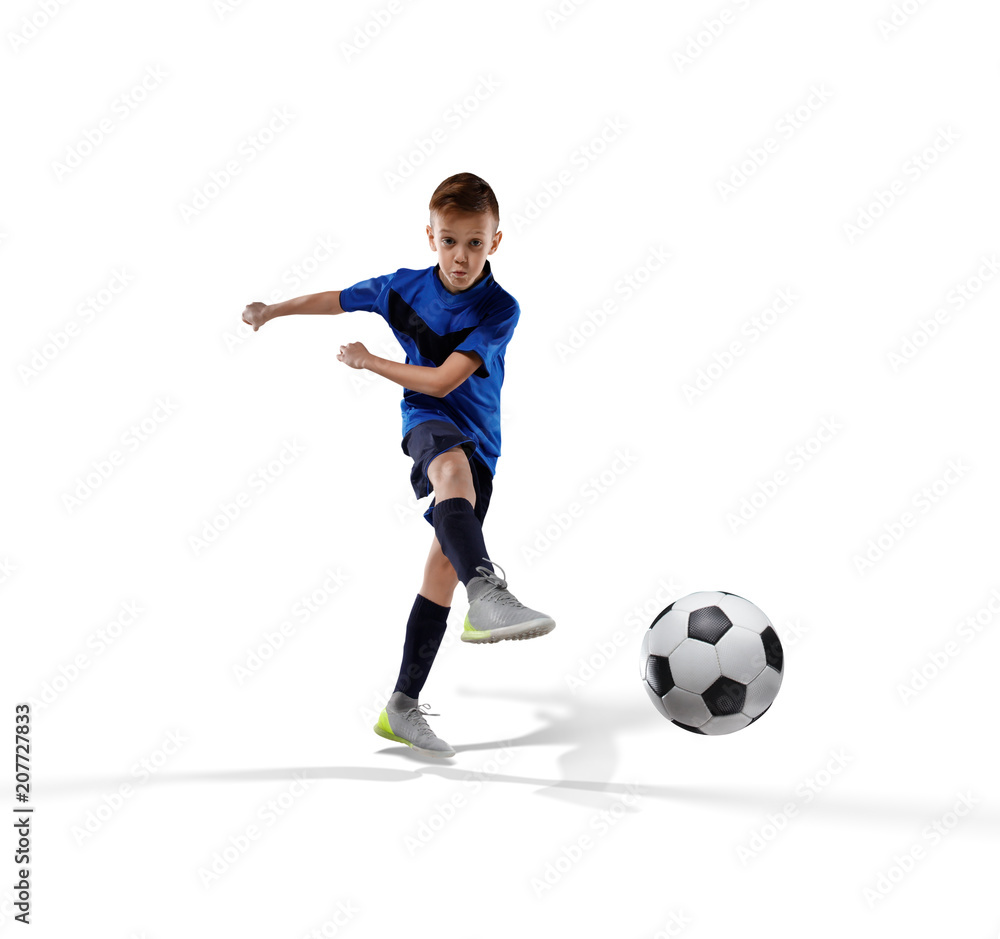 football player kid kicking the ball