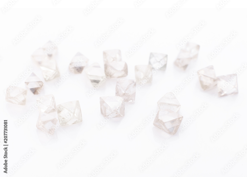 natural transparent diamonds in macro on a white background natural transparent diamonds in macro on a white background