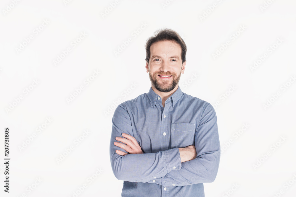 portrait of smiling bearded man with arms crossed looking at camera isolated on white portrait of smiling bearded man with arms crossed looking at camera isolated on white