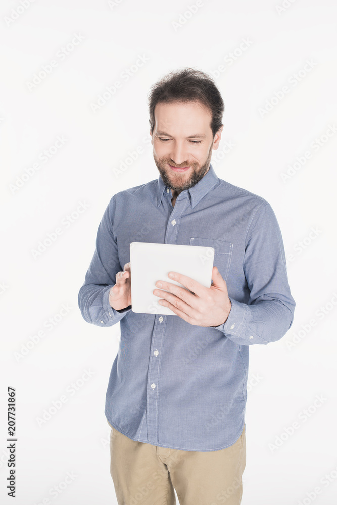 portrait of smiling man using digital tablet isolated on white portrait of smiling man using digital tablet isolated on white