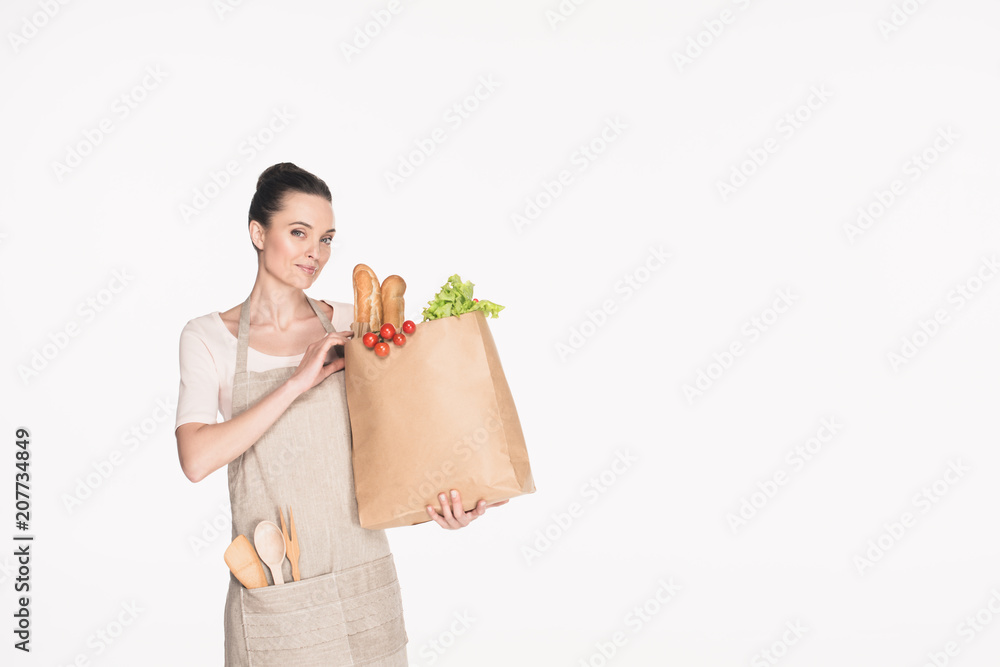 portrait of smiling woman with paper package full of food isolated on white portrait of smiling woman with paper package full of food isolated on white