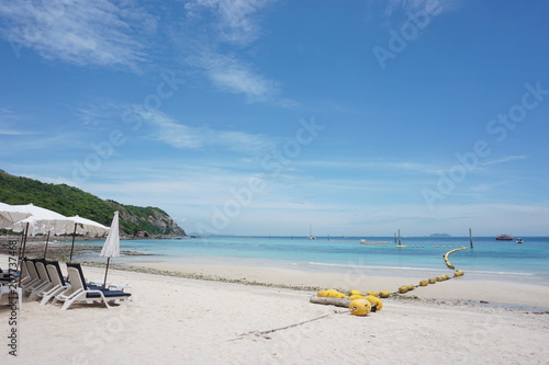 Fototapeta Naklejka Na Ścianę i Meble -  Beach chair, Floating buoys and beautiful blue sea and sky; Samae-San Island Thailand 
