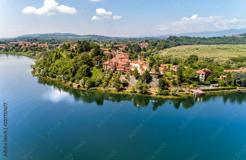 Aerial view of Lake Varese and church of San Lorenzo of Biandronno, Italy