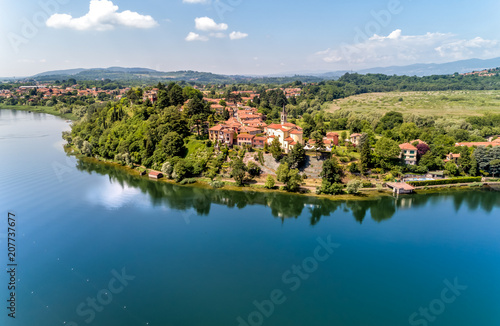 Aerial view of Lake Varese and church of San Lorenzo of Biandronno, Italy