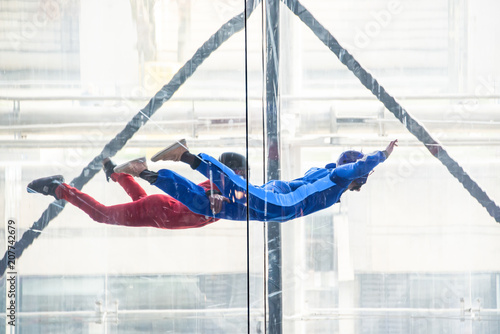 Skydivers in indoor wind tunnel, free fall simulator
