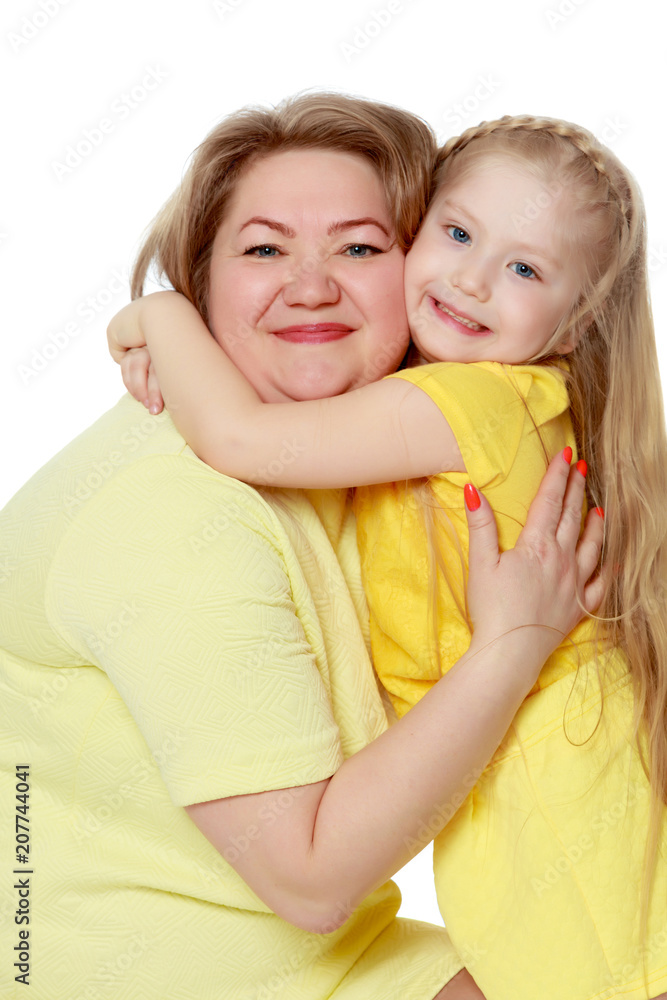 Mom and little daughter plus the size of the model, gently embra Mom and little daughter plus the size of the model, gently embra