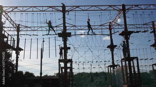 Children are playing in a rope park