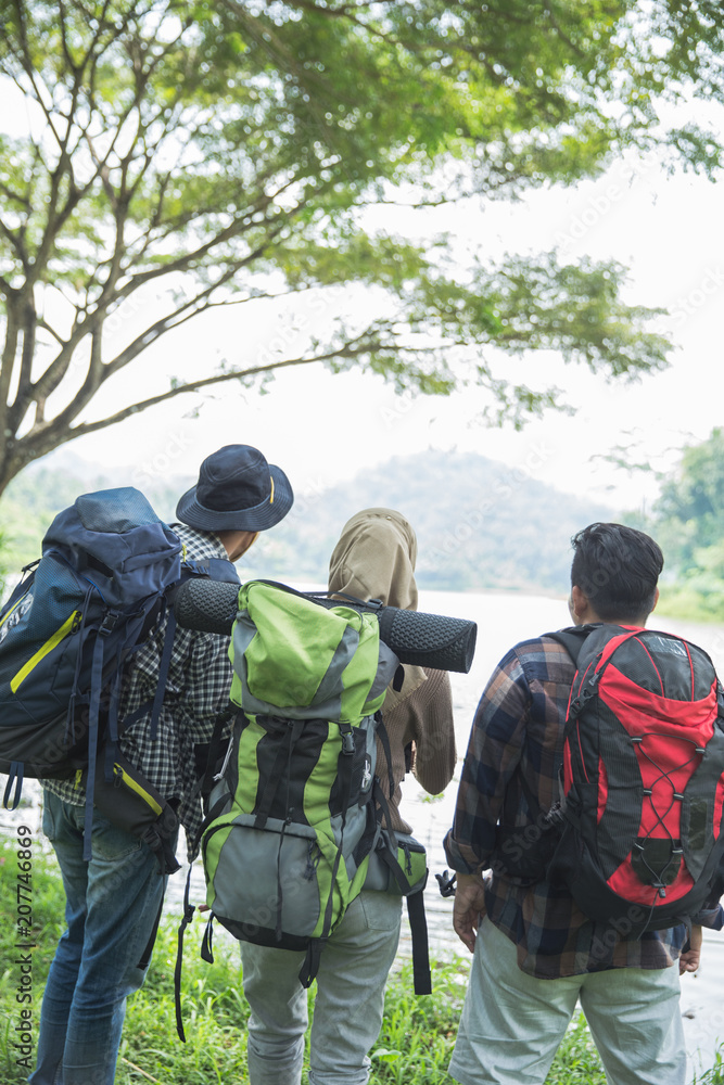 people in the forest with backpack hiking people in the forest with backpack hiking