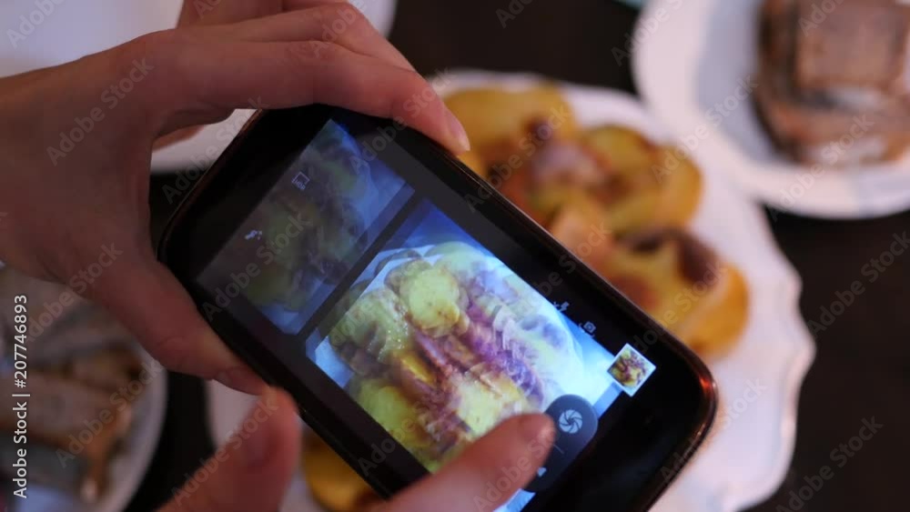 At home take a photo of food dish on a table via smart phone camera At home take a photo of food dish on a table via smart phone camera