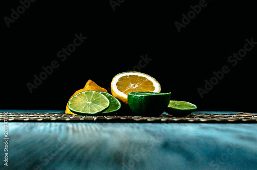 Lime and lemon splash with ice and some detox water photo