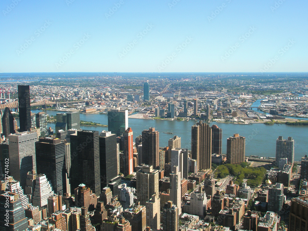 View from the Empire State Building on the city of New York on a sunny day