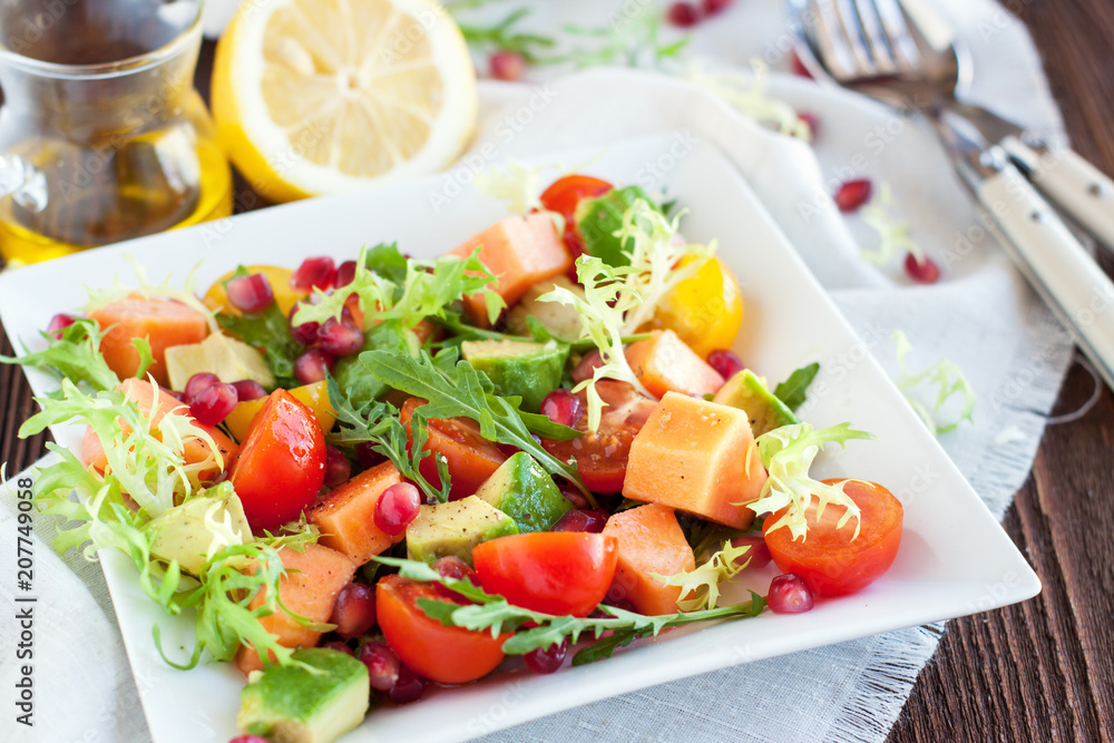 Healthy salad with papaya, avocado, tomatoes Healthy salad with papaya, avocado, tomatoes
