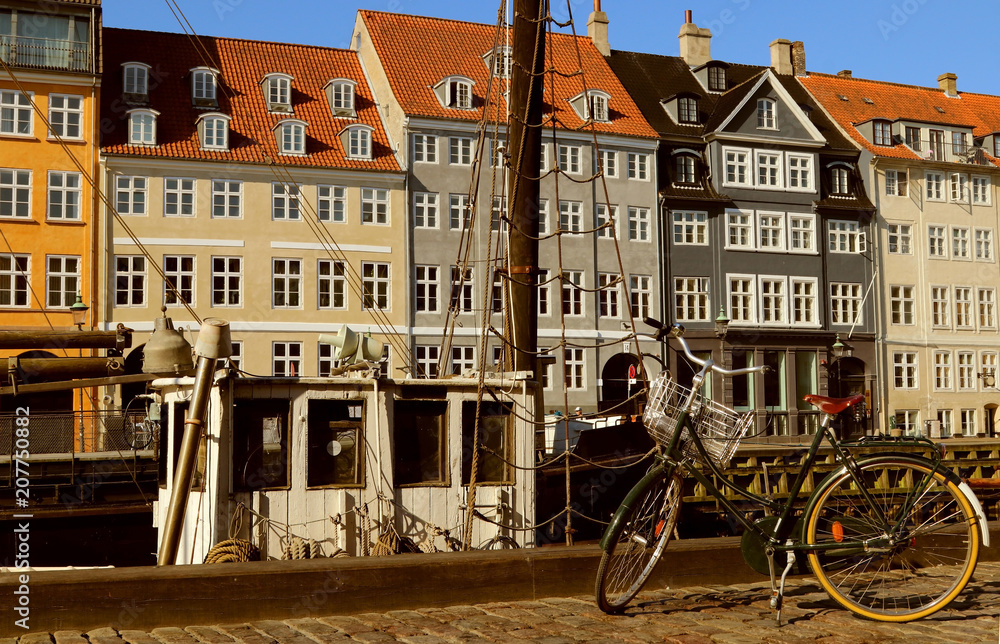  Bicycle parked on waterfront  in Nyhavn. Copenhagen, Denmark.
