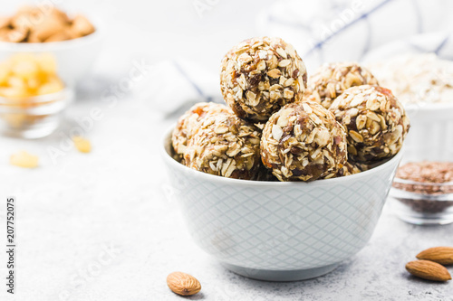Vegan dessert, raw oatmeal nuts fruit bites. Selective focus, space for text.